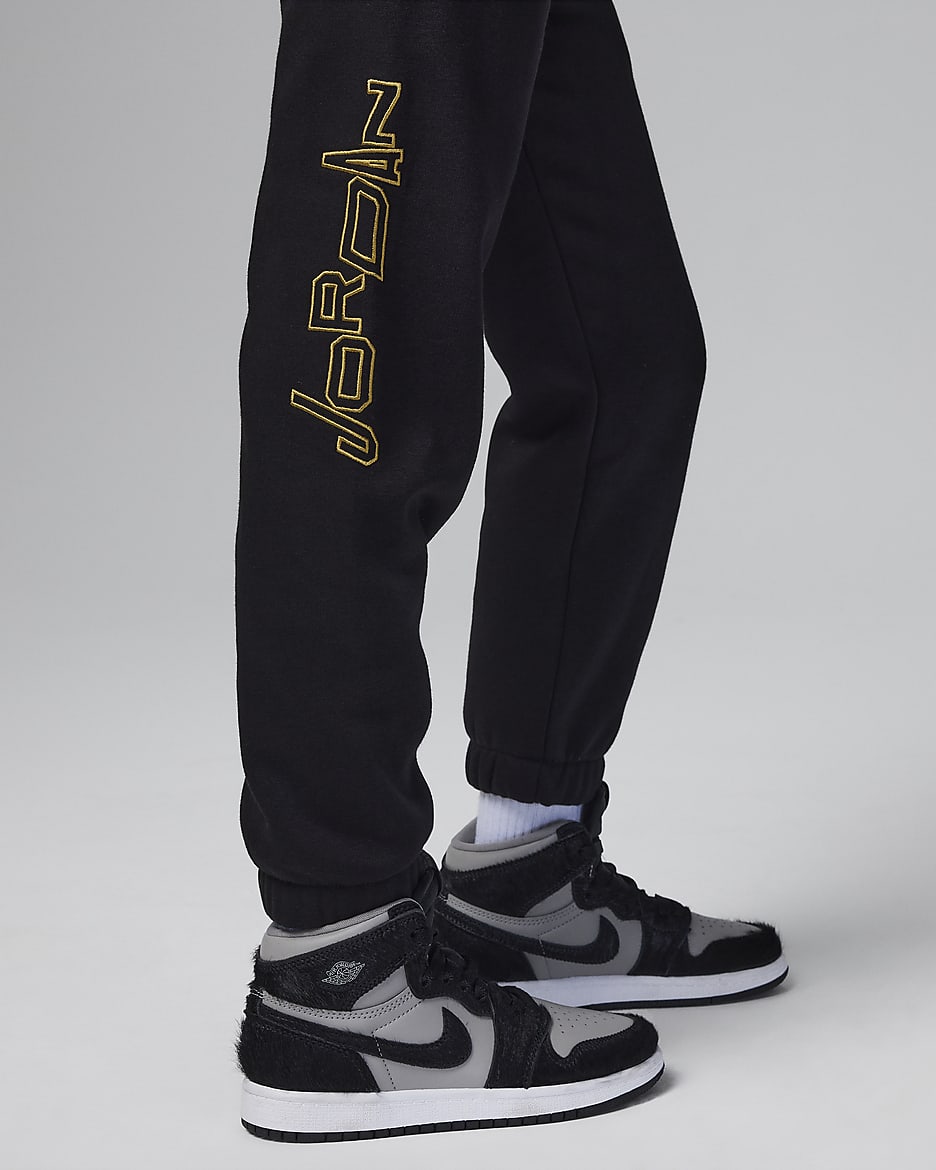 Black and gold jordan pants top